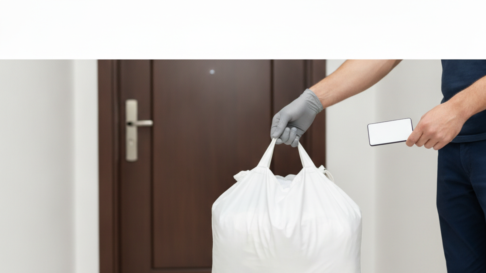 laundry pickup driver collecting a laundry bag at a Dubai apartment door